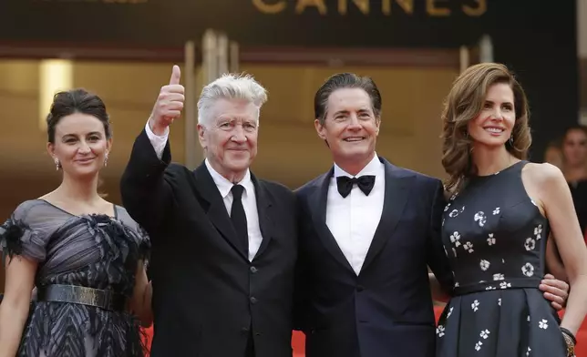 FILE - Emily Stofle, from left, director David Lynch actor Kyle MacLachlan, and Desiree Gruber appear at the screening of the TV series "Twin Peaks" at the 70th international film festival, Cannes, southern France, on May 25, 2017(AP Photo/Alastair Grant, File)
