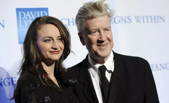 FILE - Director David Lynch and his wife Emily attend the 2nd annual Change Begins Within benefit celebration, hosted by the David Lynch Foundation on Dec. 13, 2010 in New York. (AP Photo/Evan Agostini, File)
