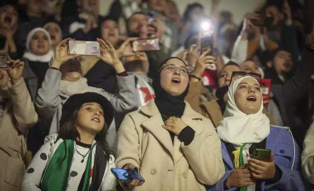 Syrians sing during a concert by the recently returned "revolutionary" singer Wasfi Maasrani in Damascus late Wednesday Jan. 8, 2025..(AP Photo/Ghaith Alsayed)