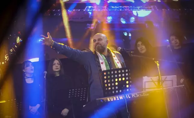 Wasfi Maasarani, a renowned singer and symbol of the Syrian uprising, performs in celebration of "Syria's victory" in Damascus Wednesday Jan. 8, 2025..(AP Photo/Ghaith Alsayed)
