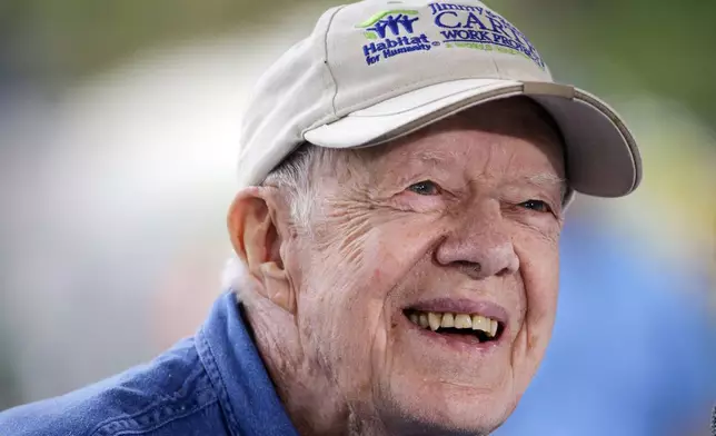 FILE - Former President Jimmy Carter answers questions during a news conference at a Habitat for Humanity building site, in Memphis, Tenn., on Nov. 2, 2015. (AP Photo/Mark Humphrey, File)