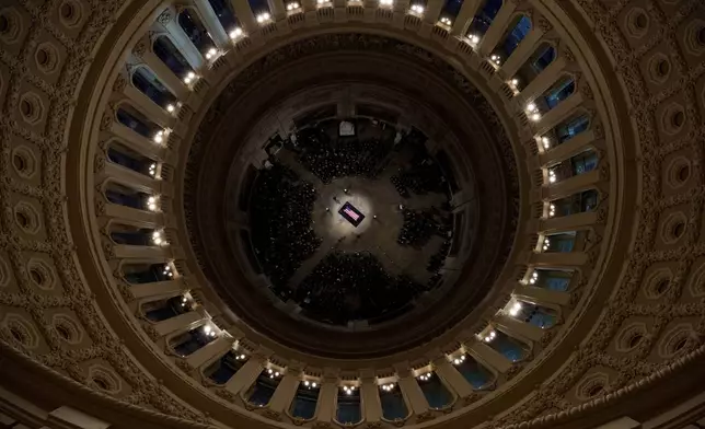 The flag-draped casket of former President Jimmy Carter lies in state at the rotunda of the U.S. Capitol Tuesday, Jan. 7, 2025, in Washington. (Andrew Harnik/Pool via AP)