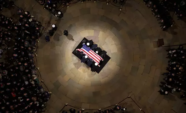 The flag-draped casket of former President Jimmy Carter lies in state at the rotunda of the U.S. Capitol Tuesday, Jan. 7, 2025, in Washington. (Andrew Harnik/Pool via AP)