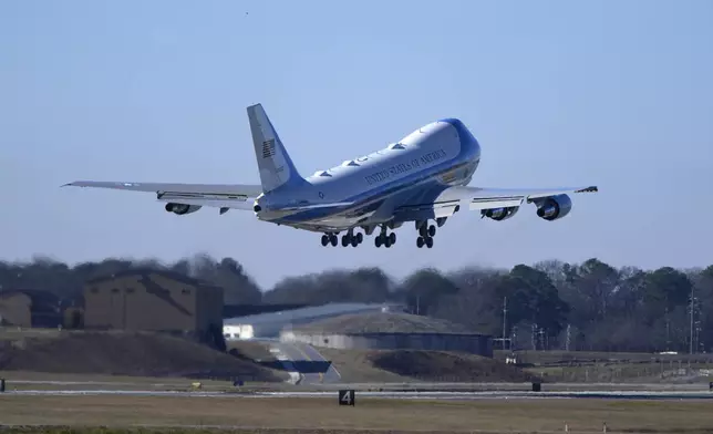 Special Air Mission 39, carrying the flag-draped casket of former President Jimmy Carter, departs Dobbins Air Reserve Base in Marietta, Ga., Tuesday, Jan. 7, 2025, en route to Washington. Carter died Dec. 29 at the age of 100. (AP Photo/Alex Brandon, Pool)