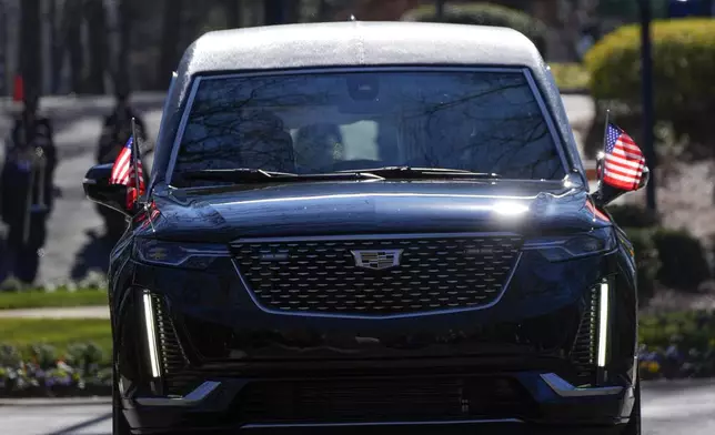 The hearse carrying the casket of former President Jimmy Carter departs the Jimmy Carter Presidential Library and Museum in Atlanta, Tuesday, Jan. 7, 2025. Carter died Dec. 29 at the age of 100. (AP Photo/Alex Brandon, Pool)