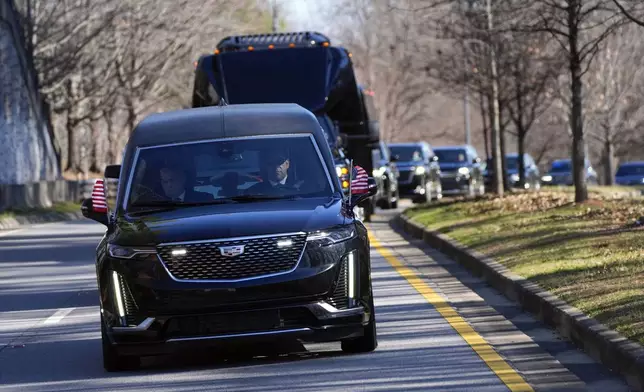 The motorcade carrying the casket of former President Jimmy Carter departs the Jimmy Carter Presidential Library and Museum in Atlanta, Tuesday, Jan. 7, 2025. Carter died Dec. 29 at the age of 100. (AP Photo/Alex Brandon, Pool)