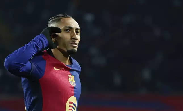 Barcelona's Raphinha celebrates after scoring his side's third goal during a Spanish Copa del Rey round of 16 soccer match between Barcelona and Real Betis at the Lluis Companys Olympic Stadium in Barcelona, Spain, Wednesday, Jan. 15, 2025. (AP Photo/Joan Monfort)