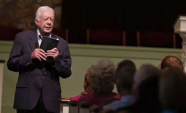 FILE - Former President Jimmy Carter teaches Sunday school at Maranatha Baptist Church in Plains, Ga, on June 8, 2014. (AP Photo/John Bazemore, File)