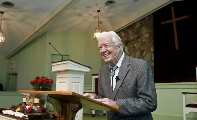 FILE - Former President Jimmy Carter teaches Sunday school at Maranatha Baptist Church in Plains, Ga., on Sept. 25, 2009. (AP Photo/John Bazemore)