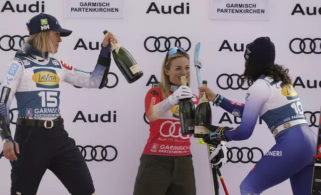 From left, second placed Norway's Kajsa Vickhoff Lie, the winner Switzerland's Lara Gut Behrami and third placed Italy's Federica Brignone celebrate after an alpine ski, women's World Cup super G, in Garmisch, Germany, Sunday, Jan. 26, 2025. (AP Photo/Piermarco Tacca)