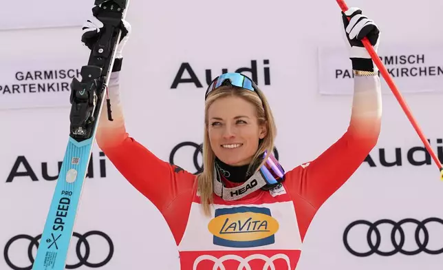 The winner Switzerland's Lara Gut Behrami celebrates after an alpine ski, women's World Cup super G, in Garmisch, Germany, Sunday, Jan. 26, 2025. (AP Photo/Piermarco Tacca)