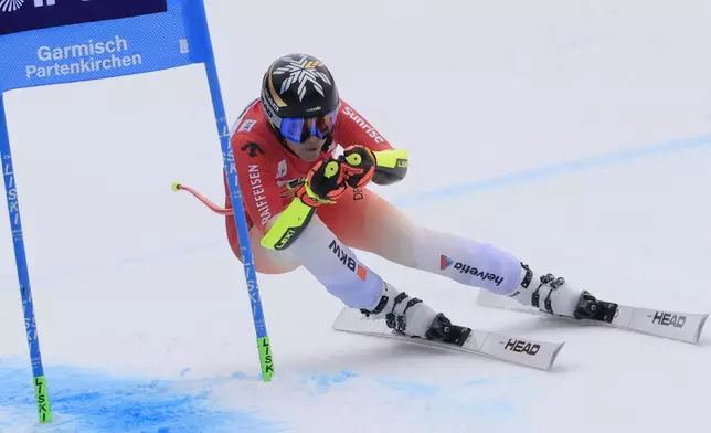 Switzerland's Lara Gut Behrami speeds down the course during an alpine ski, women's World Cup super G, in Garmisch, Germany, Sunday, Jan. 26, 2025. (AP Photo/Giovanni Maria Pizzato)