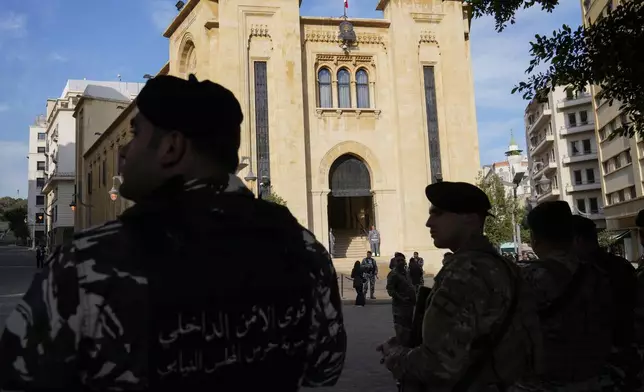 Lebanese troops stand guard in front of the parliament building before a session to elect a new Lebanese president in down town Beirut, Lebanon, Thursday, Jan. 9, 2025. (AP Photo/Hussein Malla)