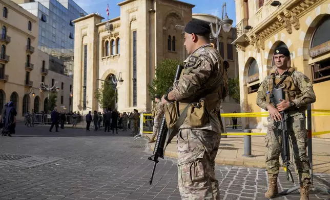 Lebanese army soldiers stand guard in front of the parliament building before a session to elect a new Lebanese president in down town Beirut, Lebanon, Thursday, Jan. 9, 2025. (AP Photo/Hussein Malla)