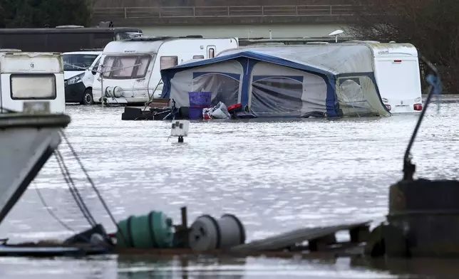 A tent sits in the floods of the river Soar at the caravan parks in Barrow Upon Soar, England, Tuesday, Jan. 7, 2025.(AP Photo/Darren Staples)