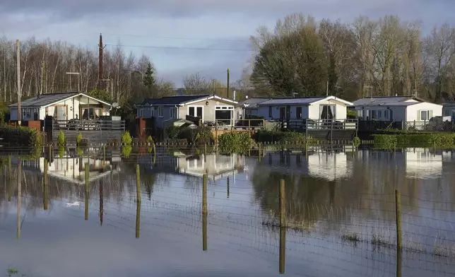 The Little Venice caravan park is seen surrounded by rising flood water in Yalding, Kent, England, Tuesday, Jan. 7, 2025. (Gareth Fuller/PA via AP)