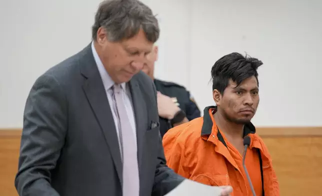 Sebastian Zapeta, right, accused of burning a woman to death inside a New York City subway train, appears in Kings County Supreme Court for an arraignment, Tuesday, Jan. 7, 2025, in New York. (AP Photo/Seth Wenig)