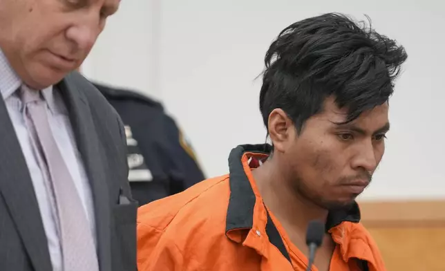 Sebastian Zapeta, right, accused of burning a woman to death inside a New York City subway train, appears in Kings County Supreme Court for an arraignment, Tuesday, Jan. 7, 2025, in New York. (AP Photo/Seth Wenig)