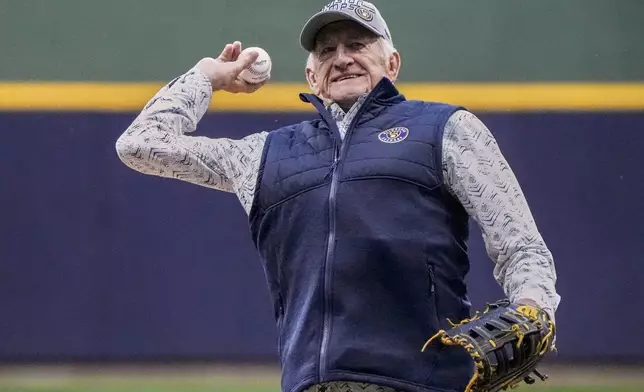 FILE - Bob Uecker throws the ceremonial first pitch before Game 1 of the National League wildcard baseball game between the Milwaukee Brewers and the Arizona Diamondbacks Tuesday, Oct. 3, 2023, in Milwaukee. (AP Photo/Morry Gash)