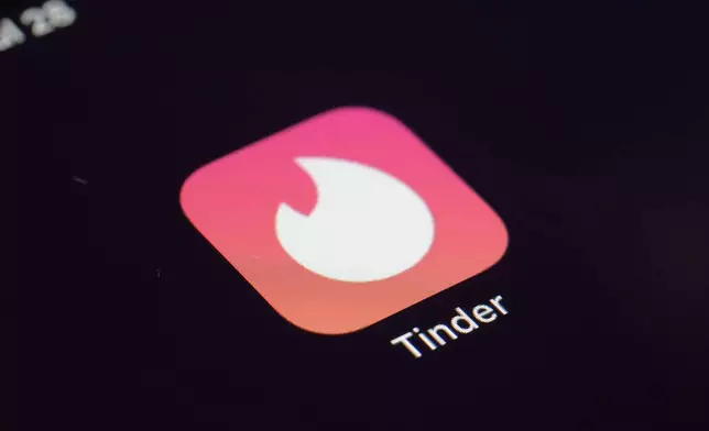 FILE - The icon for the dating app Tinder appears on a device, July 28, 2020, in New York. (AP Photo/Patrick Sison, File)