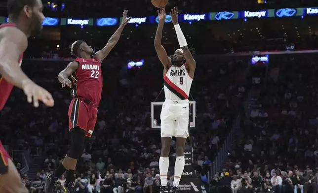 Portland Trail Blazers forward Jerami Grant (9) attempts a 3-pointer as Miami Heat forward Jimmy Butler (22) defends during the second half of an NBA basketball game, Tuesday, Jan. 21, 2025, in Miami. (AP Photo/Lynne Sladky)