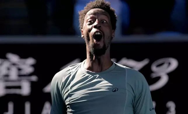Gael Monfils of France celebrates after defeating Taylor Fritz of the U.S. in their third round match at the Australian Open tennis championship in Melbourne, Australia, Saturday, Jan. 18, 2025. (AP Photo/Manish Swarup)