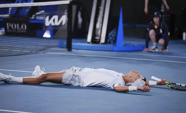 Holger Rune of Denmark celebrates after defeating Miomir Kecmanovic of Serbia in their third round match at the Australian Open tennis championship in Melbourne, Australia, Sunday, Jan. 19, 2025. (AP Photo/Vincent Thian)