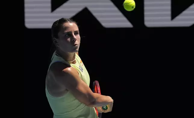 Emma Navarro of the U.S. plays a backhand return to Ons Jabeur of Tunisia during their third round match at the Australian Open tennis championship in Melbourne, Australia, Saturday, Jan. 18, 2025. (AP Photo/Manish Swarup)