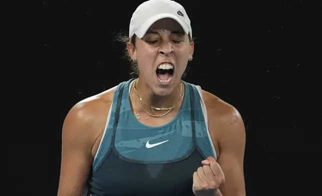 Madison Keys of the U.S. react after defeating Danielle Collins of the U.S. in their third round match at the Australian Open tennis championship in Melbourne, Australia, Saturday, Jan. 18, 2025. (AP Photo/Asanka Brendon Ratnayake)