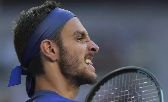 Lorenzo Musetti of Italy reacts during his third round match against Ben Shelton of the U.S. at the Australian Open tennis championship in Melbourne, Australia, Saturday, Jan. 18, 2025. (AP Photo/Ng Han Guan)