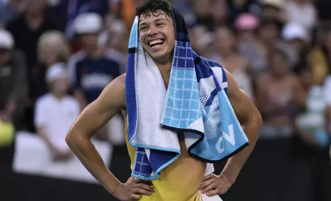 Ben Shelton of the U.S. reacts after defeating Lorenzo Musetti of Italy in their third round match at the Australian Open tennis championship in Melbourne, Australia, Saturday, Jan. 18, 2025. (AP Photo/Ng Han Guan)