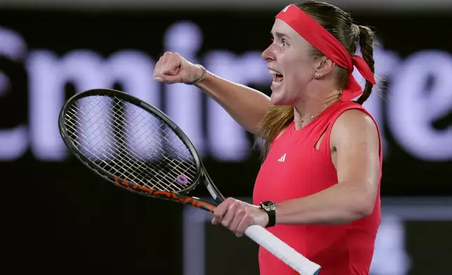 Elina Svitolina of Ukraine celebrates after defeating Jasmine Paolini of Italy in their third round match at the Australian Open tennis championship in Melbourne, Australia, Saturday, Jan. 18, 2025. (AP Photo/Vincent Thian)