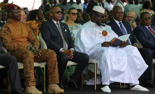 Burkina Faso's President Ibrahim Traoré, left, with Botswana's President Duma Boko, and Guinea's President Mamady Doumbouya, seen among the guests attending Ghana's President John Dramani Mahama inauguration ceremony, at the Independence Square in Accra, Ghana, Tuesday, Jan. 7, 2025. (AP Photo/Misper Apawu)