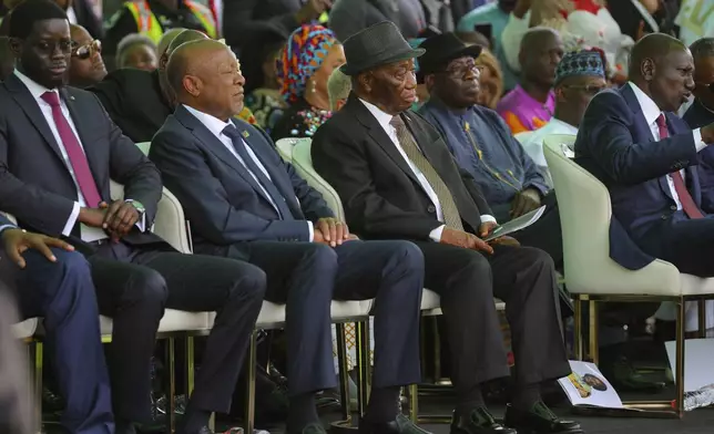 Liberia's President Joseph Boakai, centre, seen among the guests during Ghana's President John Dramani Mahama inauguration ceremony, at the Independence Square in Accra, Ghana, Tuesday, Jan. 7, 2025. (AP Photo/Misper Apawu)