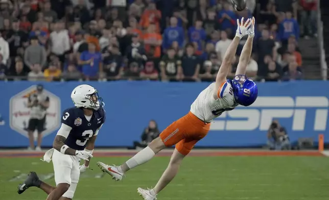 Boise State wide receiver Austin Bolt (81) can't make the catch as Penn State cornerback Jalen Kimber (3) defends during the first half of the Fiesta Bowl NCAA college football CFP quarterfinal game, Tuesday, Dec. 31, 2024, in Glendale, Ariz. (AP Photo/Rick Scuteri)