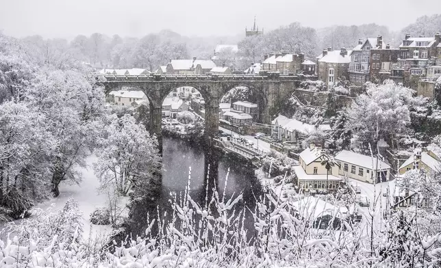 Snow covers houses and the 'Knaresborough Viaduct' in Knaresborough, England, Sunday, Jan. 5, 2025. (Danny Lawson/PA via AP)