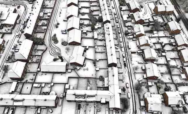 Snow blankets Lee Park in Liverpool, England, Sunday Jan. 5, 2025. (Peter Byrne/PA via AP)