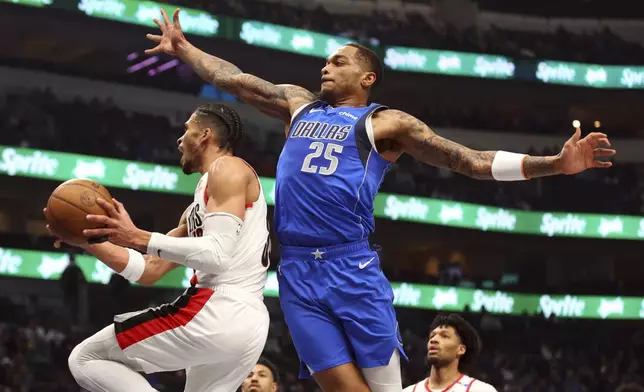 Portland Trail Blazers forward Toumani Camara shoots as Dallas Mavericks' P.J. Washington (25) of the Dallas Mavericks defends in the first half of an NBA basketball game, Thursday, Jan. 9, 2025, in Dallas. (AP Photo/Richard W. Rodriguez)