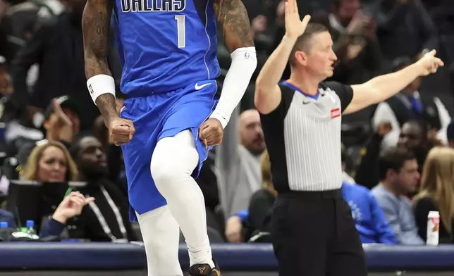 Dallas Mavericks' Jaden Hardy celebrates after a three-pointer against the Portland Trail Blazers in the first half of an NBA basketball game, Thursday, Jan. 9, 2025, in Dallas. (AP Photo/Richard W. Rodriguez)