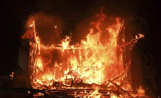 A structure is burned by the Palisades Fire in the Pacific Palisades neighborhood of Los Angeles, Thursday, Jan. 9, 2025. (AP Photo/Jae C. Hong)