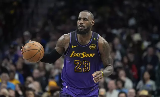 Los Angeles Lakers forward LeBron James dribbles during the second half of an NBA basketball game against the Dallas Mavericks, Tuesday, Jan. 7, 2025, in Dallas. (AP Photo/LM Otero)