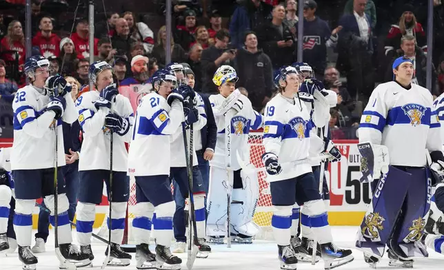 Finland players react following their overtime loss in the IIHF World Junior Hockey Championship gold medal game against the United States in Ottawa, Ontario, Sunday, Jan. 5, 2025. (Sean Kilpatrick/The Canadian Press via AP)