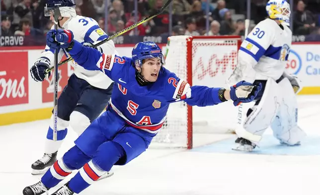 USA forward Teddy Stiga (2) celebrates scoring the game-winning goal on Finland goaltender Petteri Rimpinen (30) to end overtime IIHF World Junior Hockey Championship gold medal game in Ottawa, Ontario, Sunday, Jan. 5, 2025. (Sean Kilpatrick/The Canadian Press via AP)