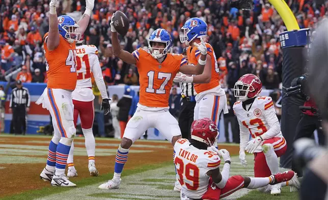 Denver Broncos wide receiver Devaughn Vele (17) celebrates after catching a touchdown pass during the first half of an NFL football game against the Kansas City Chiefs Sunday, Jan. 5, 2025, in Denver. (AP Photo/David Zalubowski)