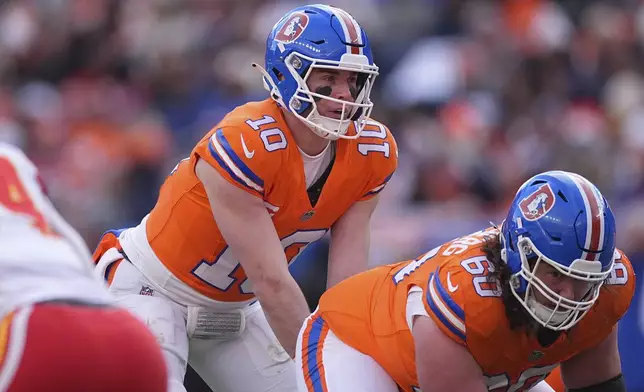 Denver Broncos quarterback Bo Nix waits for the snap during the first half of an NFL football game against the Kansas City Chiefs Sunday, Jan. 5, 2025, in Denver. (AP Photo/David Zalubowski)