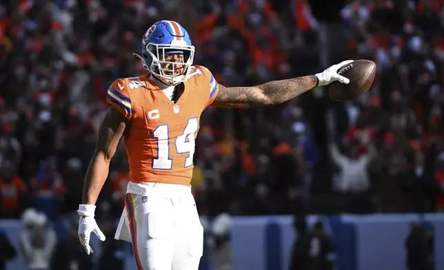 Denver Broncos wide receiver Courtland Sutton (14) celebrates after catching a pass during the first half of an NFL football game against the Kansas City Chiefs Sunday, Jan. 5, 2025, in Denver. (AP Photo/Geneva Heffernan)