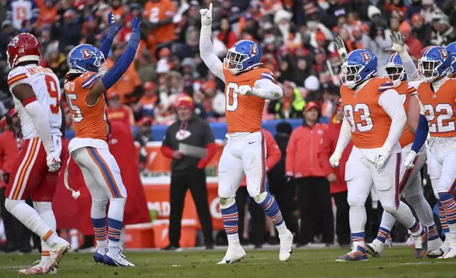 Denver Broncos outside linebacker Jonathon Cooper (0) celebrates after sacking Kansas City Chiefs quarterback Carson Wentz during the first half of an NFL football game Sunday, Jan. 5, 2025, in Denver. (AP Photo/Geneva Heffernan)