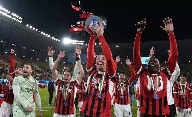 AC Milan's Francesco Camarda celebrates with teammates after winning the Italian Super Cup final soccer match between AC Milan and Inter Milan at Al Awwal Park Stadium in Riyadh, Saudi Arabia, Monday, Jan. 6, 2025. (AP Photo/Altaf Qadri)