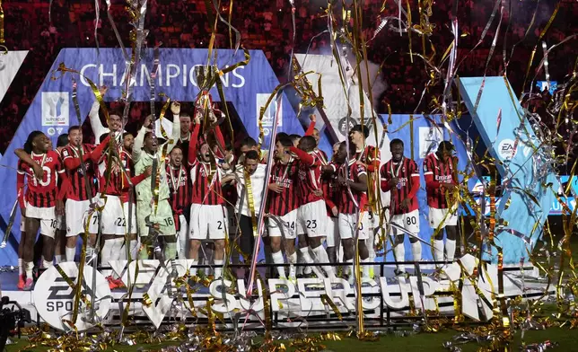 AC Milan's team celebrates after winning the Italian Super Cup final soccer match between AC Milan and Inter Milan at Al Awwal Park Stadium in Riyadh, Saudi Arabia, Monday, Jan. 6, 2025. (AP Photo/Altaf Qadri)