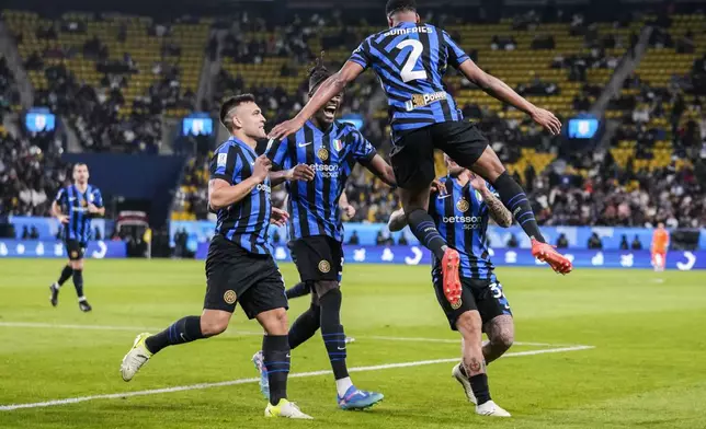 Inter Milan's Denzel Dumfries celebrates after scoring the opening goal during the Italian Super Cup semifinal soccer match between Inter Milan and Atlanta at Al Awwal Park stadium in Riyadh, Saudi Arabia, Thursday, Jan. 2, 2025. (AP Photo/Altaf Qadri)